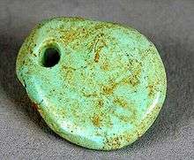 Trade in turquoise crafts, such as this freeform pendant dating from 