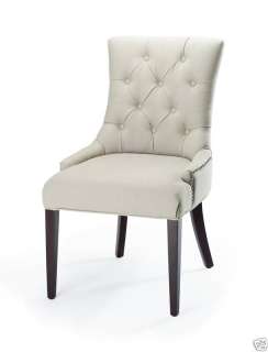With a sleek, button tufted design, this Nimes side chair will add a 