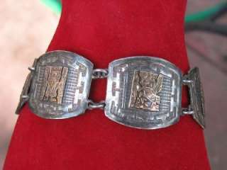   Mayan or Incan symbols. This piece is stamped 18k 925 on the catch