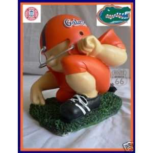   GATORS FOOTBALL PLAYER COLLEGE PIGGY/COIN BANK: Sports & Outdoors