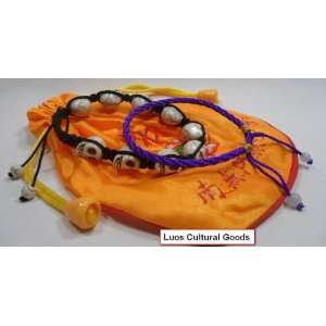 Set of 3) A white Skull bracelet, A Purple String Bracelet & a Mala 