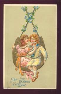 young couple making a toast sitting in golden horseshoe swing